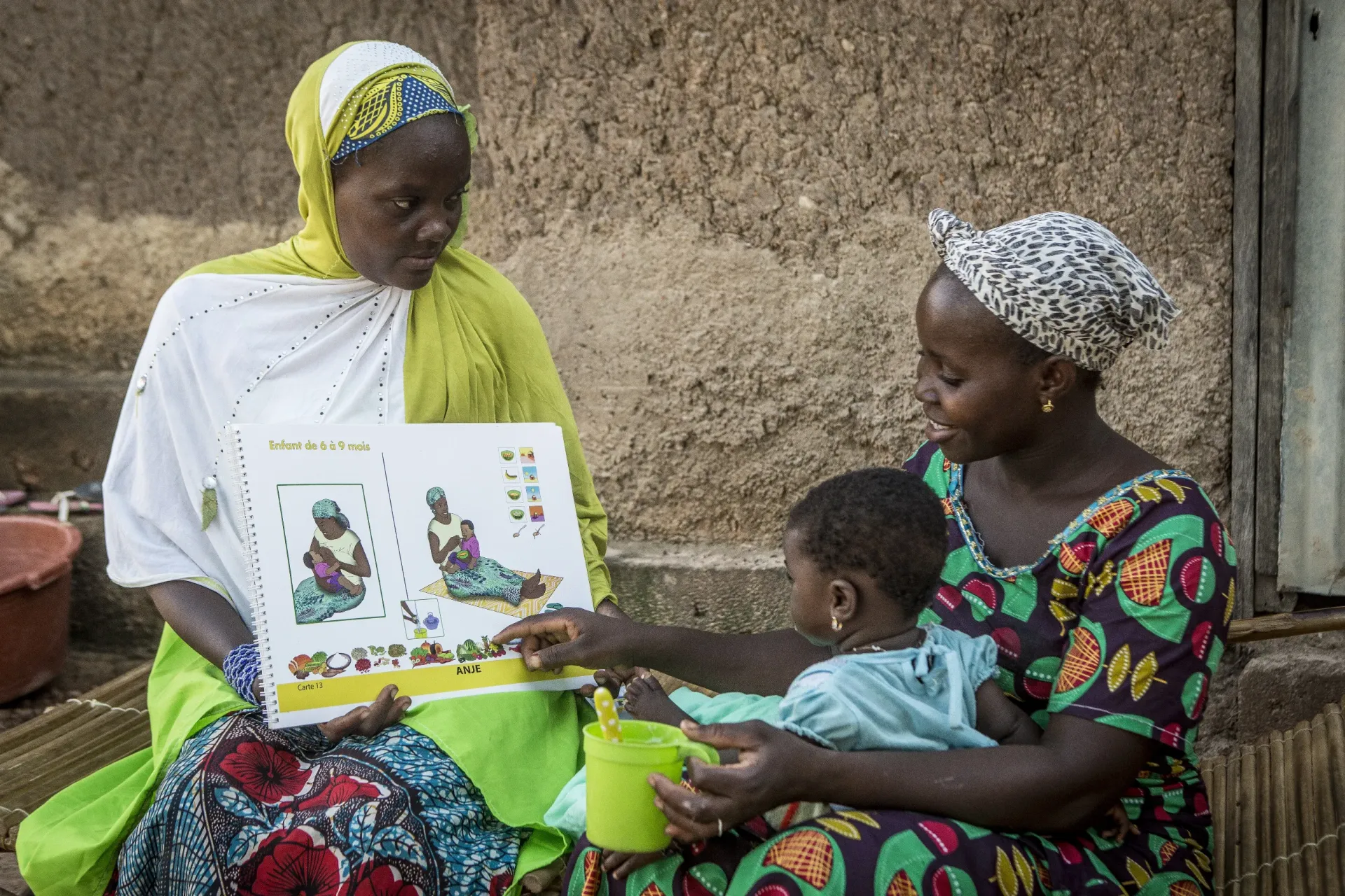 A Role Model Mother within the 10-member Nutrition Support Group in Zebala village visits a family.